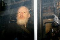 what is julian assange accused of